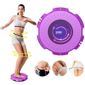 Woman wearing light gray sporty shorts and crop top using a purple balance board