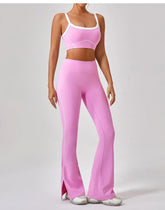 Woman wearing pink fitted sports bra and high-waisted flared leggings with white trim