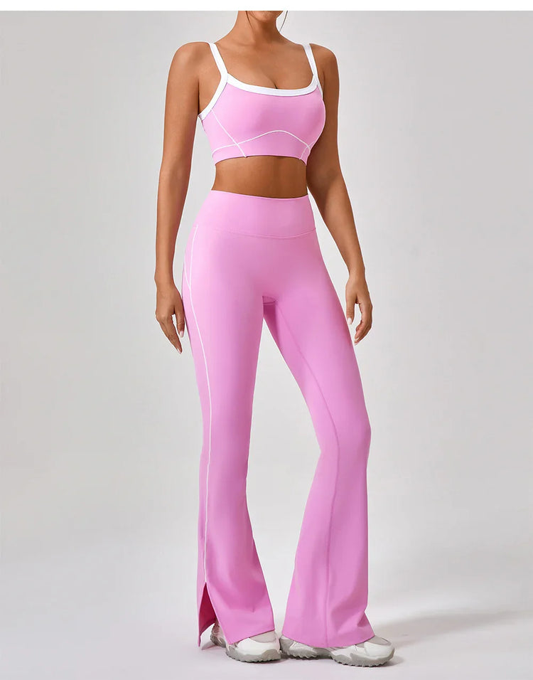 Woman wearing pink fitted sports bra and high-waisted flared leggings with white trim