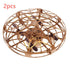 Gold metallic drone with protective cage and visible propellers, modern tech accessory