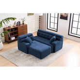 Modern blue upholstered sectional sofa with plush cushions and chaise lounge on a beige rug