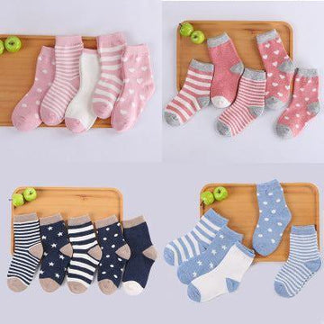 Assorted cotton crew socks in pink, navy, and blue with stripes, hearts, and star patterns.