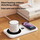 Desk with white mug warmer and wireless phone charger, minimalist tech accessory