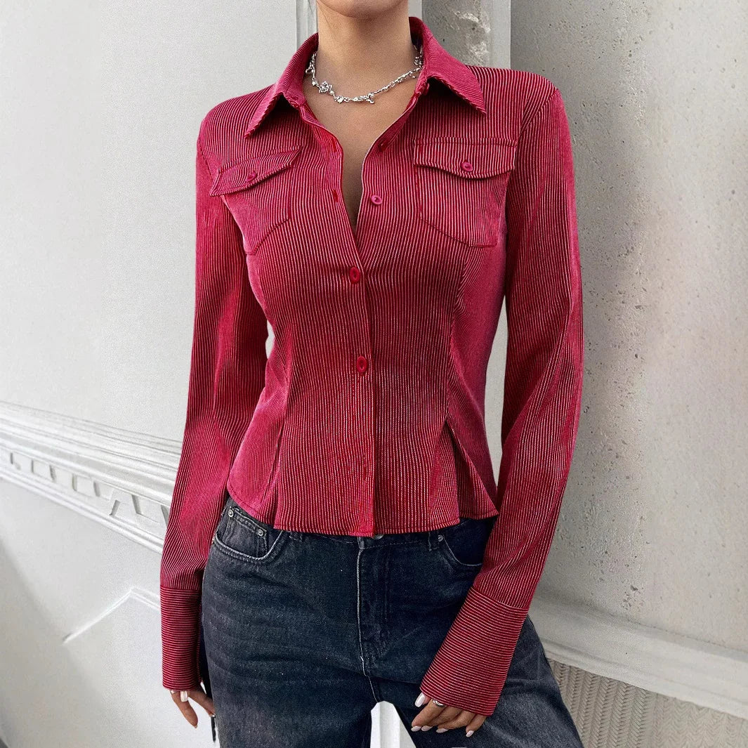 Fitted red pinstripe long-sleeve shirt with pointed collar and chest pockets, styled with dark jeans