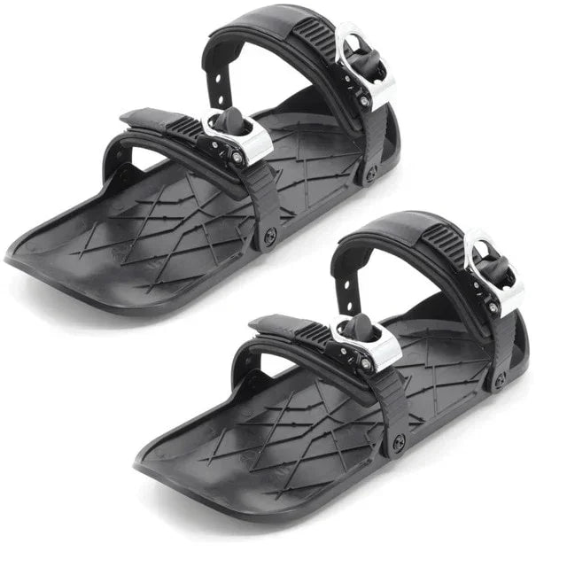 Pair of black adjustable plastic slip-on shoe covers with textured sole and buckle straps