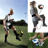 Youth wearing loose fit gray athletic shirt and black shorts using soccer training belt outdoors.