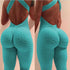 Aqua textured seamless jumpsuit with criss-cross back, body-hugging fit, stretchy material