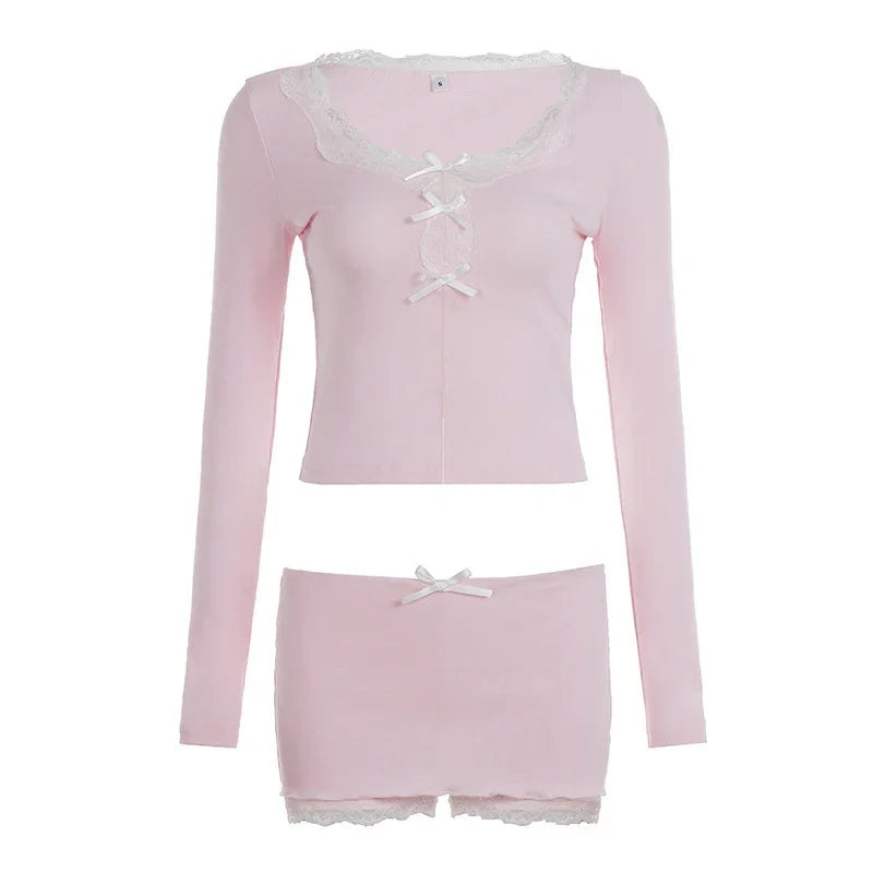 Light pink long sleeve crop top and mini skirt set with lace trim and ribbon accents.