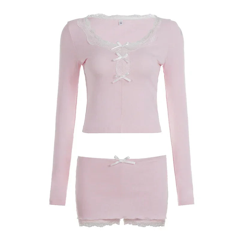 Light pink long sleeve crop top and mini skirt set with lace trim and ribbon accents.
