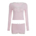 Light pink long sleeve crop top and mini skirt set with lace trim and ribbon accents.