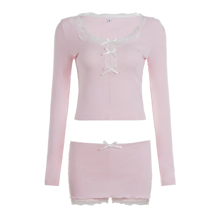 Light pink long sleeve crop top and mini skirt set with lace trim and ribbon accents.
