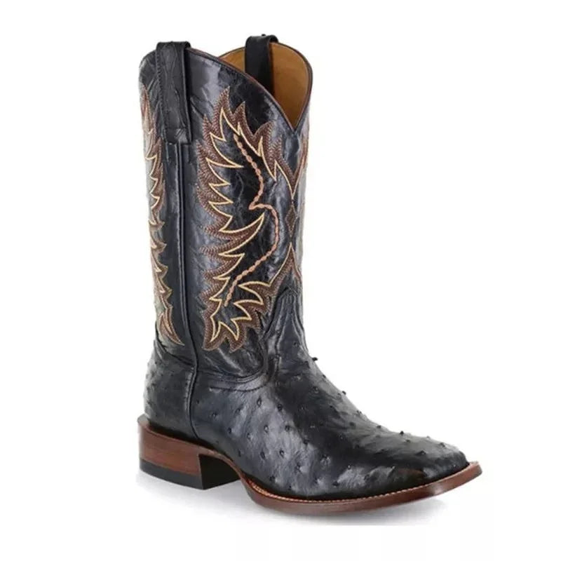 Black leather cowboy boot with textured finish, brown stitching, and square toe design