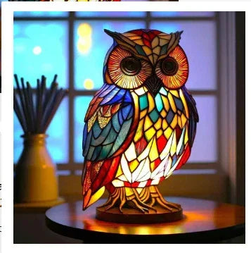 Colorful stained glass owl lamp with geometric pattern on a round table indoors