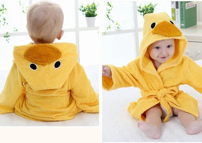 Baby wearing yellow hooded duck robe, soft plush material, loose fit, playful design