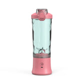 Pink portable blender with clear plastic bottle and power button, modern design