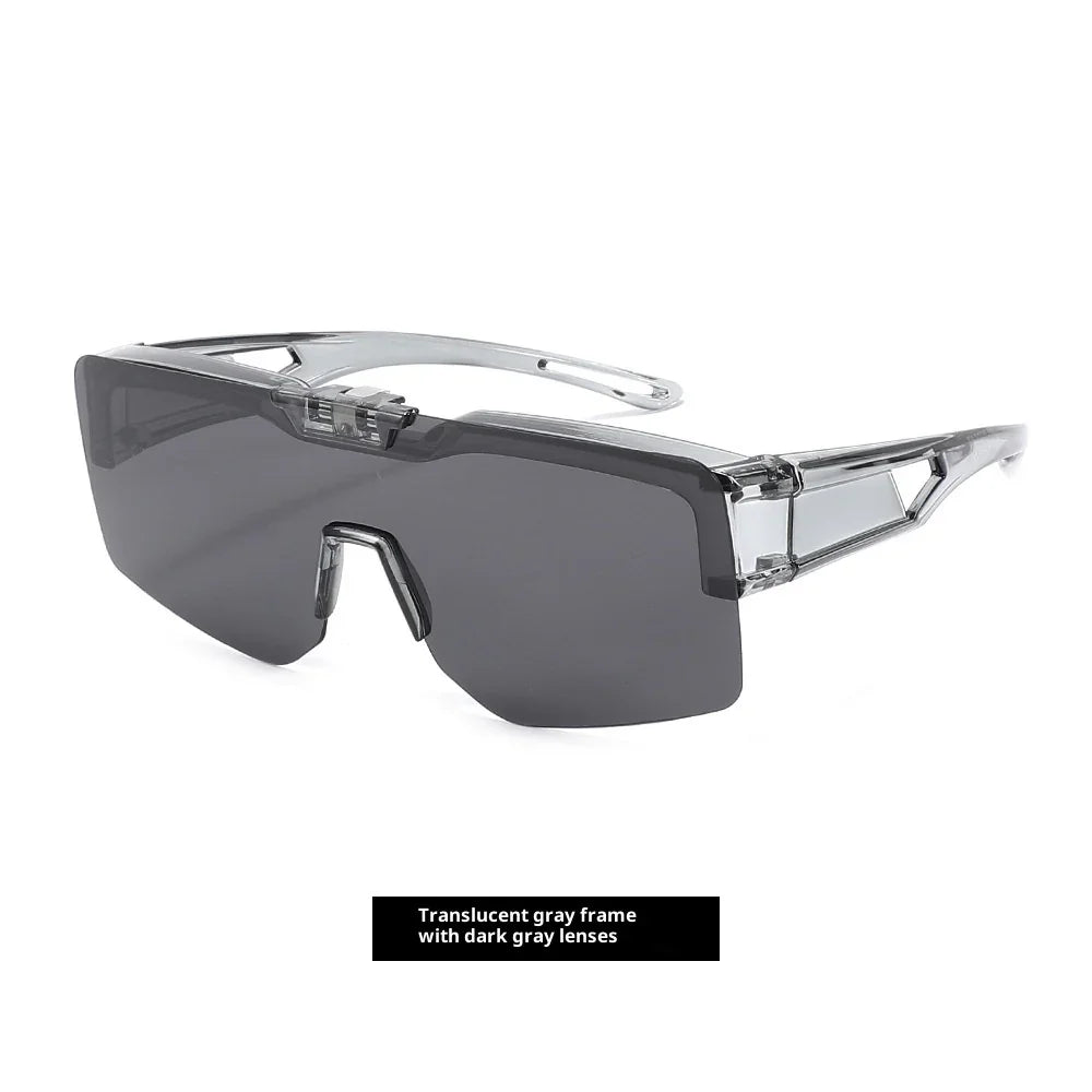 Futuristic sunglasses with a translucent gray frame and oversized dark gray lenses.