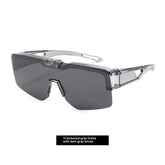 Futuristic sunglasses with a translucent gray frame and oversized dark gray lenses.