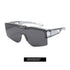 Futuristic sunglasses with a translucent gray frame and oversized dark gray lenses.
