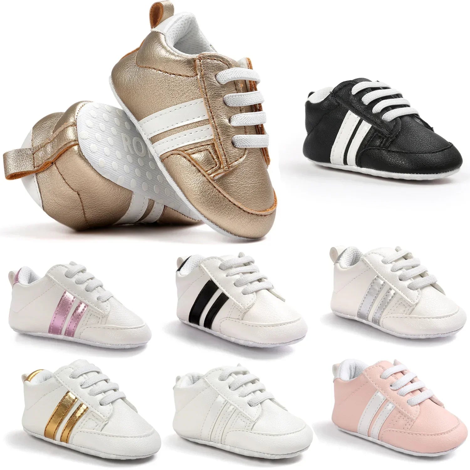 Assorted baby sneakers in metallic gold, black, white, and pink with faux leather material and sporty striped design.
