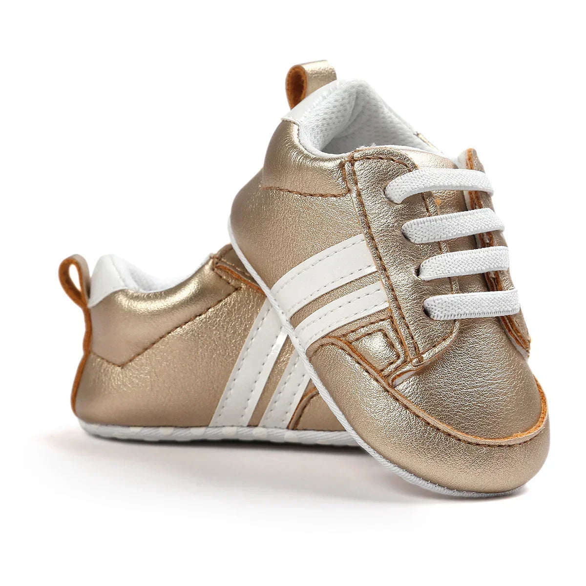 Metallic gold baby sneakers with white stripes, faux leather material, soft sole, lace-up style