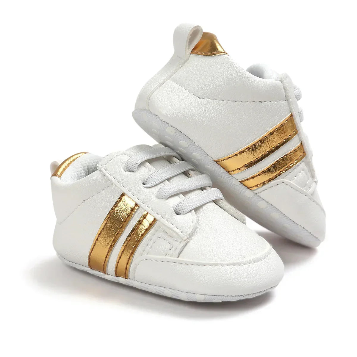 White faux leather baby sneakers with gold metallic stripes and soft sole, sporty fit