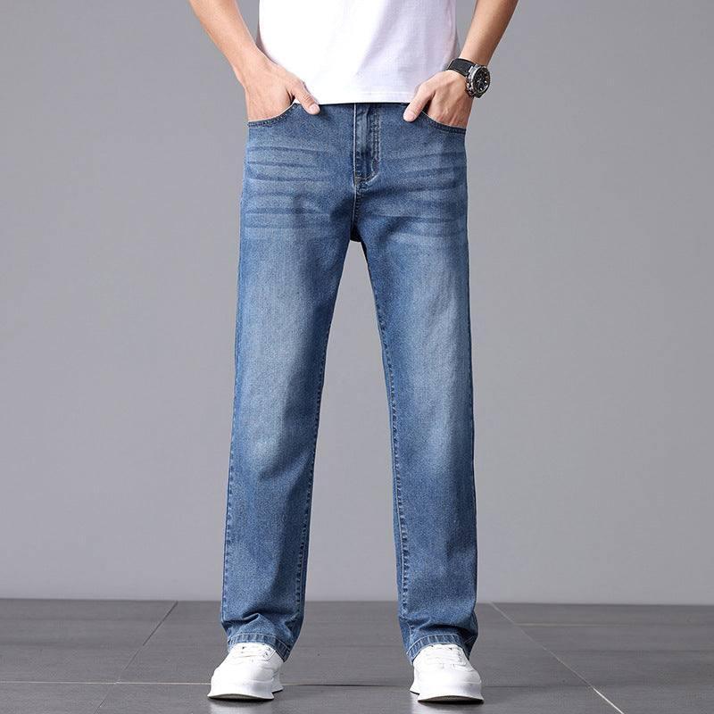 Straight leg blue denim jeans with relaxed fit and light wash, styled for streetwear.