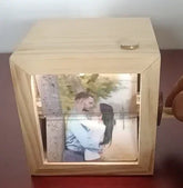 Wooden photo box with rotating handle, displaying a romantic couple&