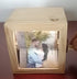 Wooden photo box with rotating handle, displaying a romantic couple&
