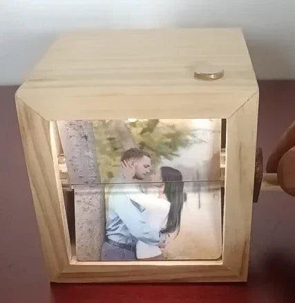 Wooden photo box with rotating handle, displaying a romantic couple&