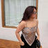 Woman wearing paisley print silk scarf top with spaghetti straps and relaxed fit