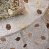 Sheer mesh fabric with gold embroidered swirls and brown polka dots, lightweight texture