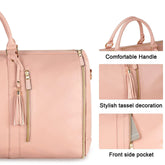 Light pink faux leather handbag with gold zippers, tassel accents, front pocket, and dual handles