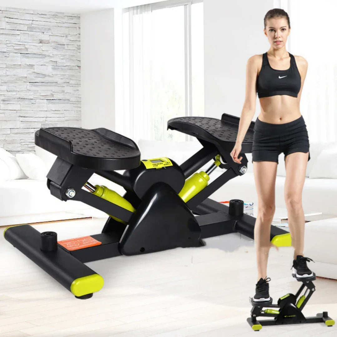 Woman in black athletic crop top and shorts using a compact black and yellow stepper fitness machine indoors