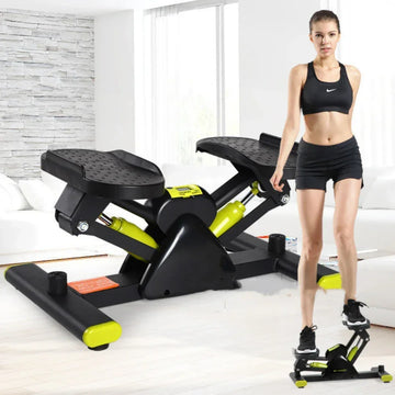Woman in black athletic crop top and shorts using a compact black and yellow stepper fitness machine indoors