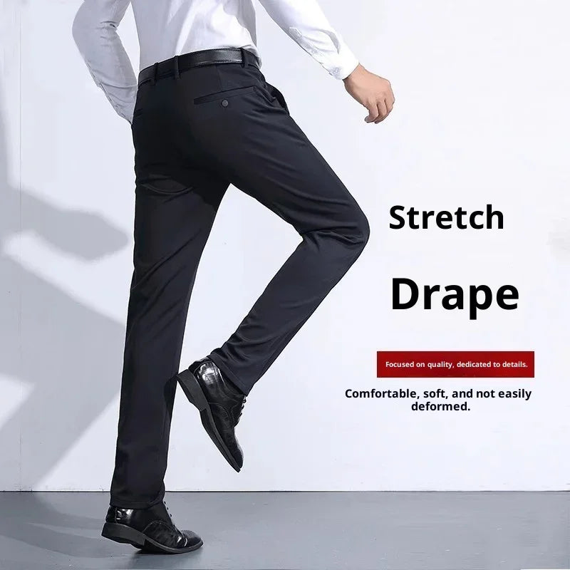 Men's slim-fit black dress pants with stretch drape, soft material, and modern silhouette.