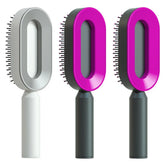 Modern oval hair brushes with ergonomic handles in gray and vibrant pink colors