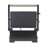 Electric panini press with non-stick black grill plates and stainless steel handle