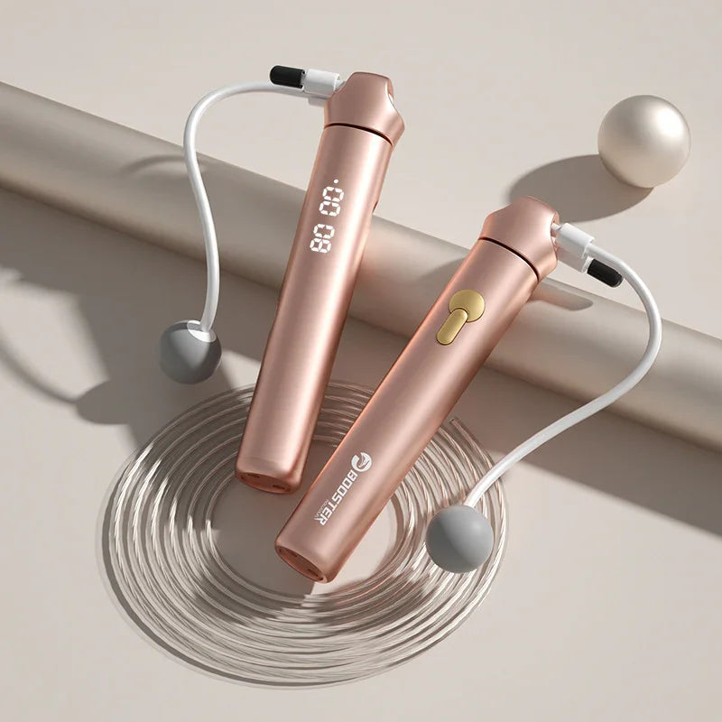 Rose gold digital cordless jump rope with weighted handles and LED display on neutral background