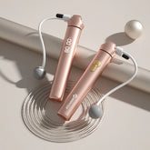 Rose gold digital cordless jump rope with weighted handles and LED display on neutral background