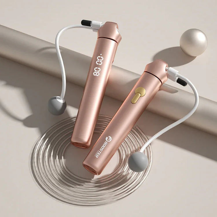 Rose gold digital cordless jump rope with weighted handles and LED display on neutral background
