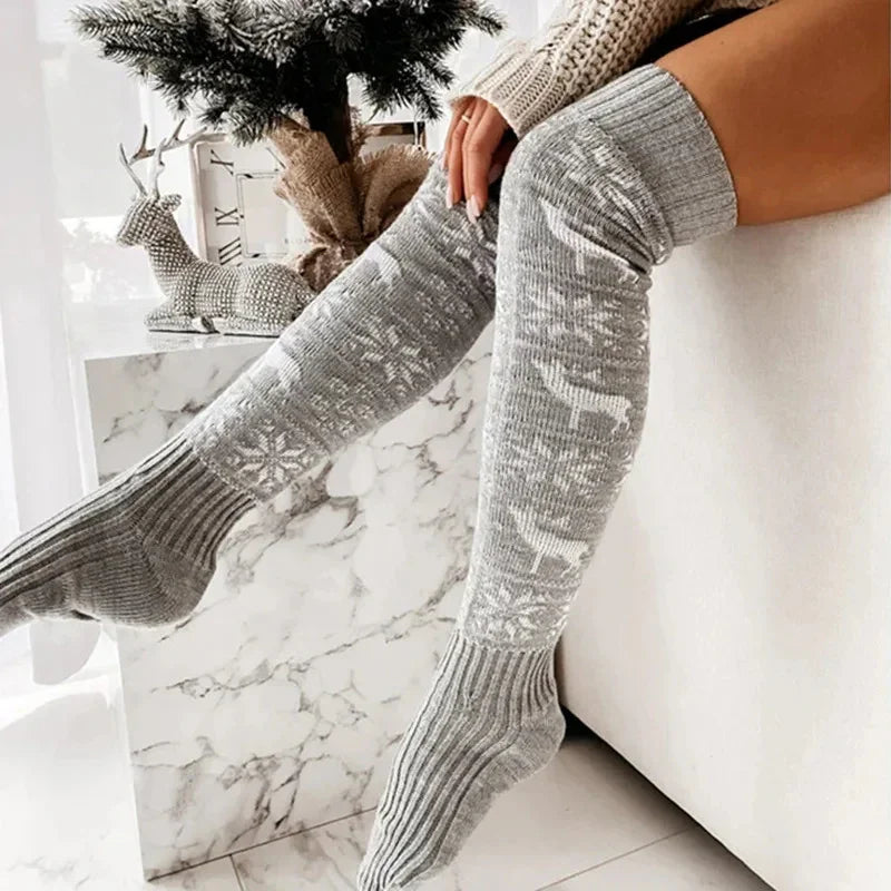 Gray knit over-the-knee socks with white snowflake and reindeer pattern, cozy fit.
