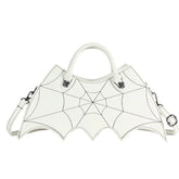 White faux leather handbag with spider web stitching and batwing edges, structured fit