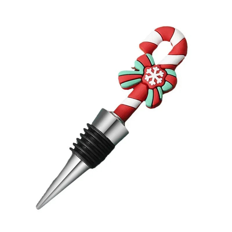 Red and white candy cane wine bottle stopper with festive bow and snowflake design.