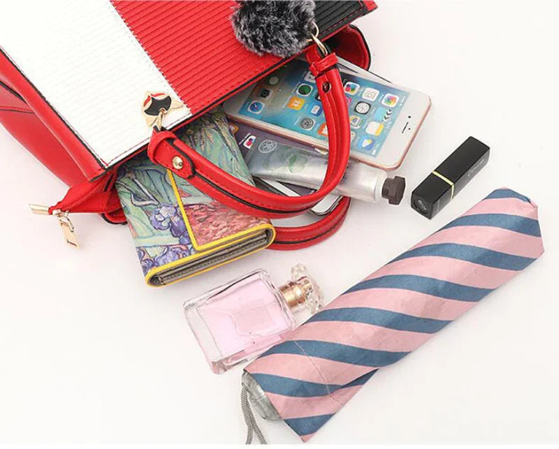 Red and white structured handbag with textured vegan leather, spacious fit, and gold accents