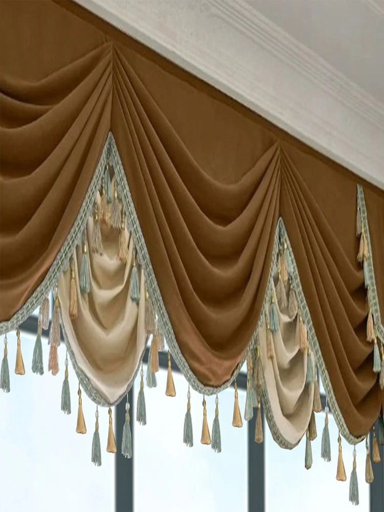 Brown and cream velvet window valance with pleated drapes and decorative tassels