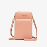 Pink faux leather crossbody bag with gold zippers, slim fit, minimalist streetwear style