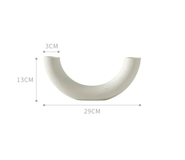 Curved white ceramic vase with matte finish, measuring 29cm wide and 13cm tall.