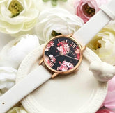 White leather strap watch with floral print black dial, rose gold case, elegant style