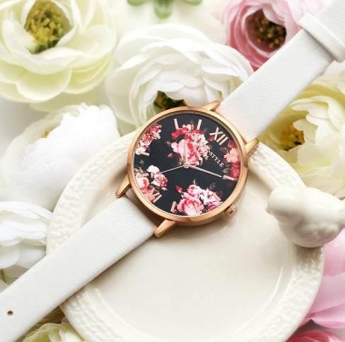 White leather strap watch with floral print black dial, rose gold case, elegant style