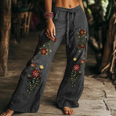 Wide-leg charcoal gray linen pants with colorful floral embroidery and relaxed fit